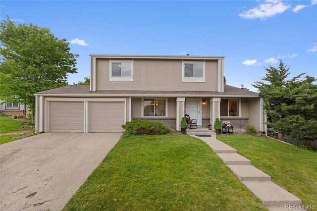 4650 S Idalia St, Aurora, CO 80015 - traditional-style house featuring concrete driveway, a front lawn, a garage, roof with shingles, and covered porch