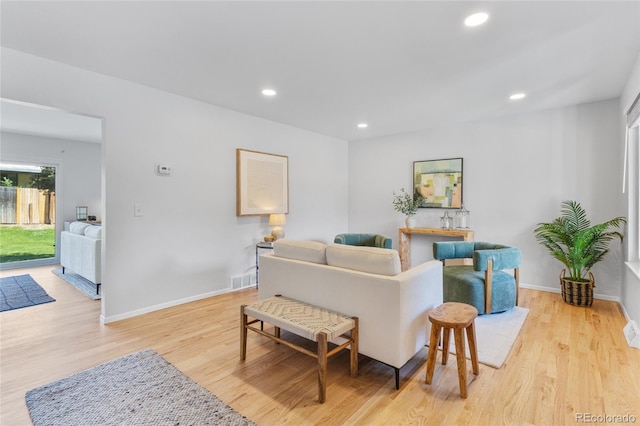 4650 S Idalia St, Aurora, CO 80015 - living room featuring light wood finished floors, recessed lighting, and baseboards