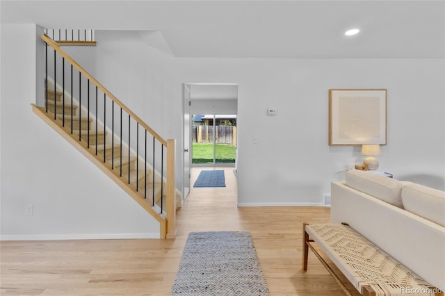 4650 S Idalia St, Aurora, CO 80015 - entryway with wood finished floors, baseboards, stairway, and recessed lighting