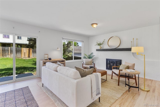 4650 S Idalia St, Aurora, CO 80015 - living room with wood finished floors and a fireplace