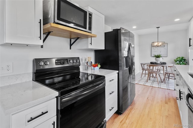 4650 S Idalia St, Aurora, CO 80015 - kitchen featuring appliances with stainless steel finishes, white cabinets, light wood-type flooring, and recessed lighting