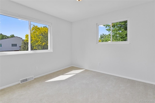 4650 S Idalia St, Aurora, CO 80015 - carpeted spare room featuring baseboards and healthy amount of natural light