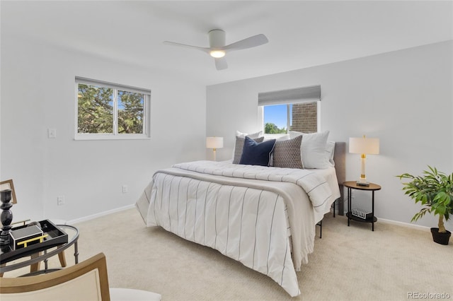 4650 S Idalia St, Aurora, CO 80015 - bedroom featuring light carpet, multiple windows, baseboards, and ceiling fan