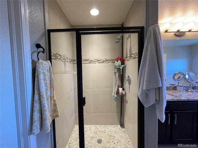 bathroom featuring vanity and walk in shower