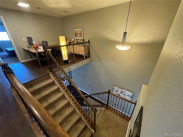 stairway with hardwood / wood-style flooring