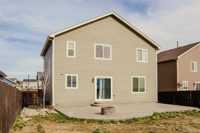 back of house with a patio area