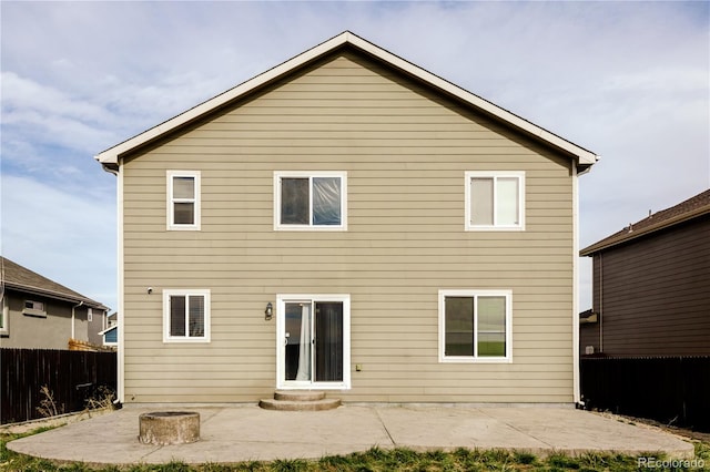 back of property with a patio