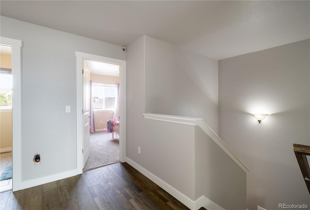 corridor with dark wood-type flooring