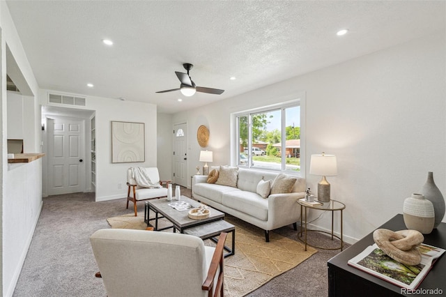 1330 Oak Pl, Thornton, CO 80229 - living area featuring light colored carpet, recessed lighting, ceiling fan, baseboards, and a textured ceiling