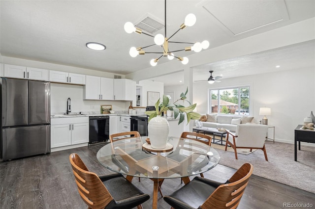 1330 Oak Pl, Thornton, CO 80229 - dining space with dark wood-style flooring, a ceiling fan, and a chandelier
