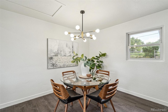 1330 Oak Pl, Thornton, CO 80229 - dining room featuring baseboards, wood finished floors, and a chandelier