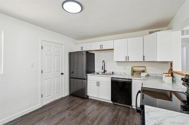 1330 Oak Pl, Thornton, CO 80229 - kitchen featuring black appliances, a sink, dark wood-style floors, white cabinets, and baseboards