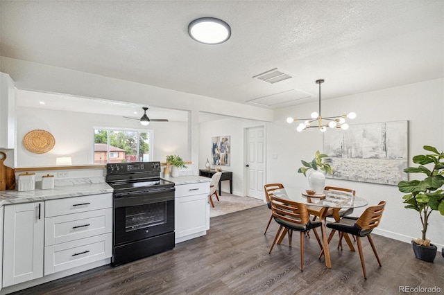 1330 Oak Pl, Thornton, CO 80229 - kitchen featuring black / electric stove, dark wood finished floors, white cabinetry, light stone counters, and a textured ceiling