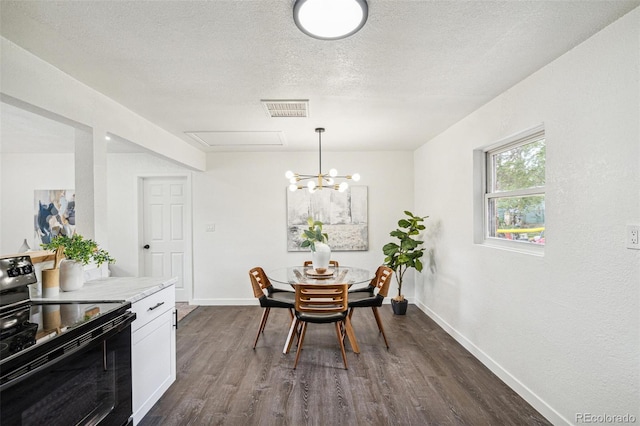 1330 Oak Pl, Thornton, CO 80229 - dining room featuring dark wood finished floors, baseboards, a chandelier, and a textured ceiling
