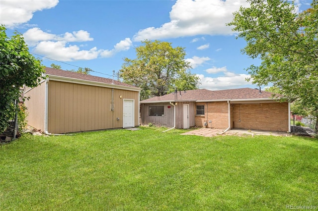 1330 Oak Pl, Thornton, CO 80229 - rear view of house with a yard, a patio area, and an outdoor structure