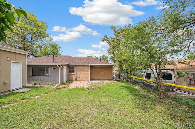 1330 Oak Pl, Thornton, CO 80229 - back of house featuring brick siding, a patio area, and a shingled roof