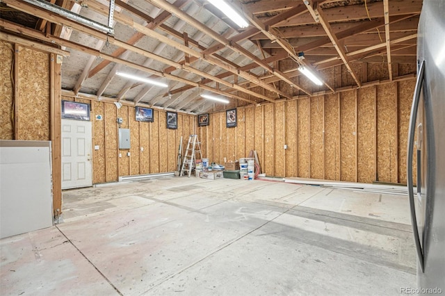 1330 Oak Pl, Thornton, CO 80229 - garage featuring stainless steel refrigerator and electric panel