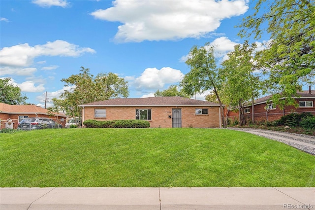 1330 Oak Pl, Thornton, CO 80229 - ranch-style home featuring brick siding and driveway