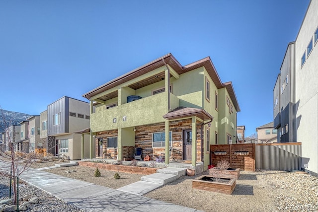 view of front of house featuring a balcony