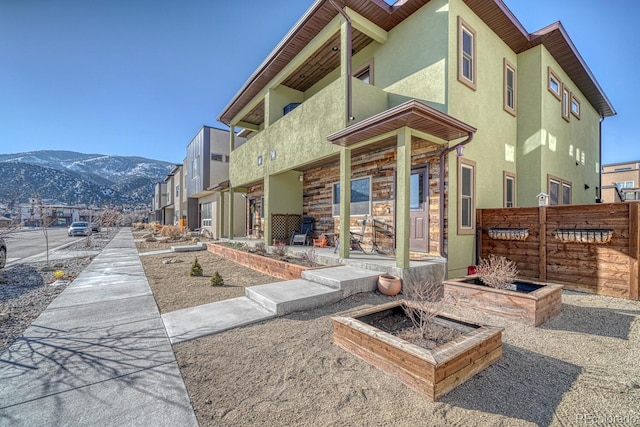 rear view of property featuring a mountain view