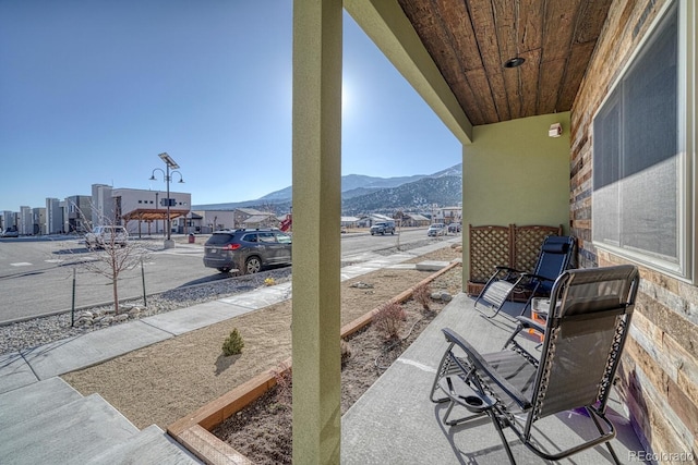 view of patio / terrace featuring a mountain view