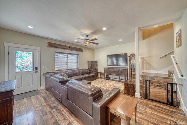 living room with hardwood / wood-style floors and ceiling fan