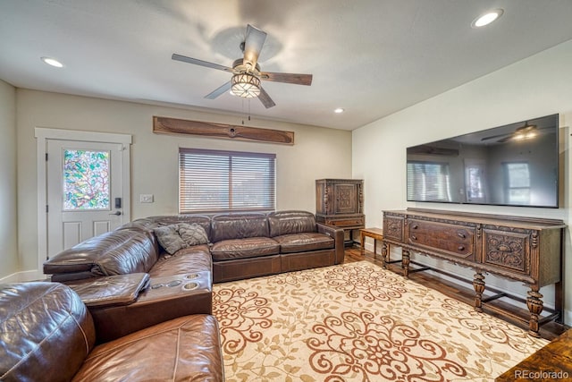 living room featuring ceiling fan and light wood-type flooring