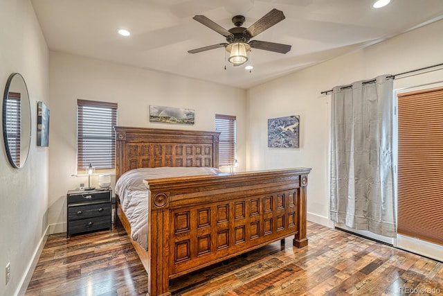 bedroom with ceiling fan and dark hardwood / wood-style floors