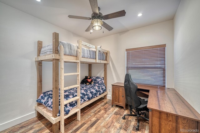 bedroom featuring hardwood / wood-style flooring and ceiling fan