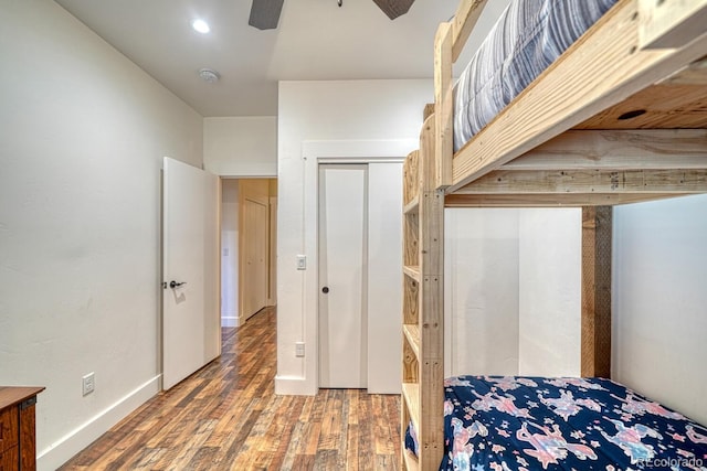 bedroom with ceiling fan and wood-type flooring