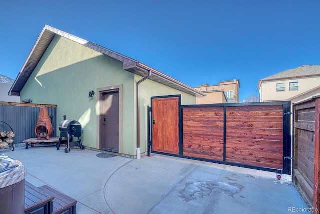 view of patio featuring grilling area and a fireplace