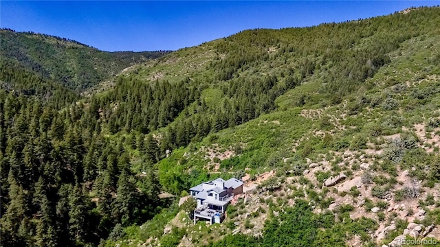 2602 Hidden Valley Rd, Sedalia, CO 80135 - view of mountain backdrop featuring a heavily wooded area
