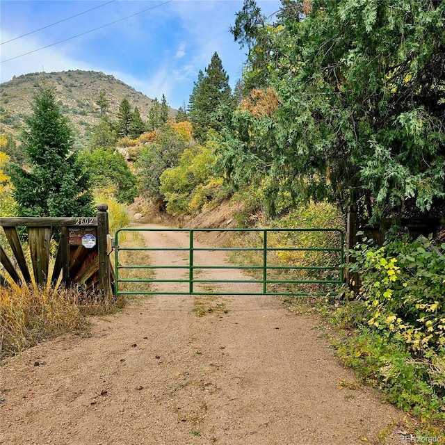2602 Hidden Valley Rd, Sedalia, CO 80135 - gate with a mountain view