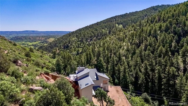2602 Hidden Valley Rd, Sedalia, CO 80135 - aerial view of property and surrounding area featuring a forest