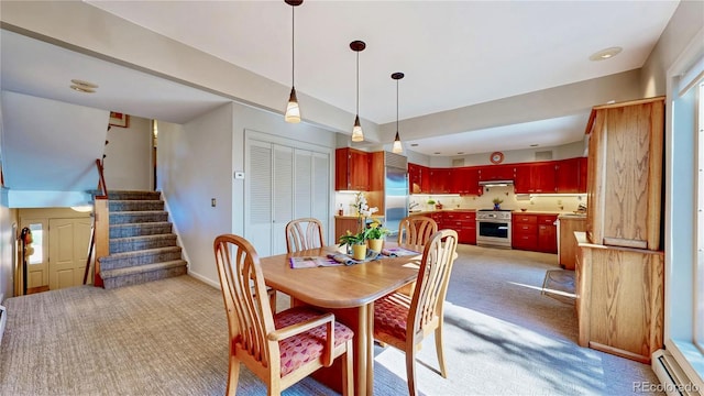 2602 Hidden Valley Rd, Sedalia, CO 80135 - dining room featuring light carpet, baseboard heating, and stairway