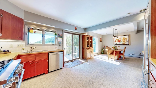 2602 Hidden Valley Rd, Sedalia, CO 80135 - kitchen featuring dishwasher, range, light colored carpet, light countertops, and baseboard heating