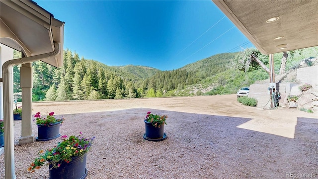 2602 Hidden Valley Rd, Sedalia, CO 80135 - view of yard featuring a mountain view and a patio area