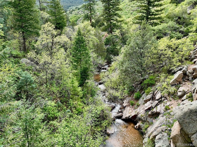 2602 Hidden Valley Rd, Sedalia, CO 80135 - aerial view of property and surrounding area with a heavily wooded area