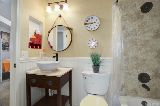 full bathroom featuring vanity, toilet, and shower / bath combo with shower curtain