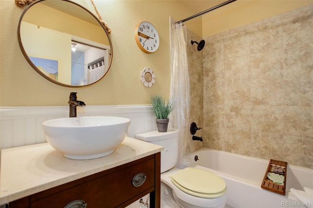 full bathroom featuring vanity, toilet, and shower / bath combo with shower curtain