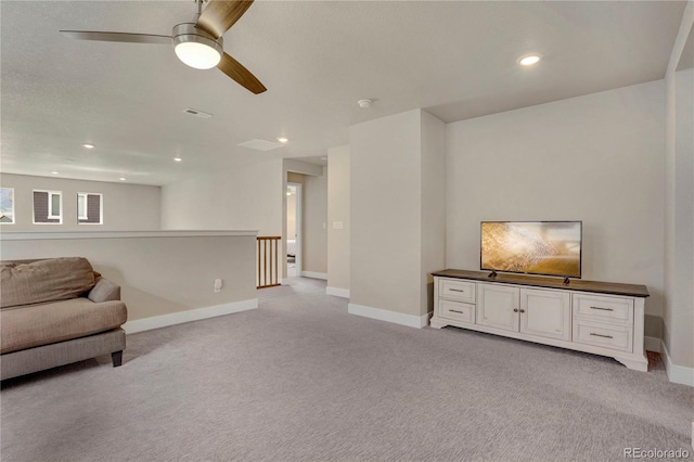 9836 Banner Peak St, Littleton, CO 80125 - sitting room with light carpet, baseboards, a ceiling fan, recessed lighting, and an upstairs landing