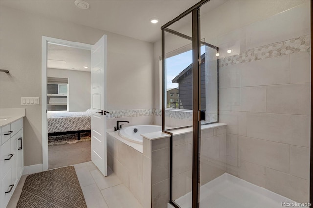9836 Banner Peak St, Littleton, CO 80125 - ensuite bathroom featuring a shower stall, vanity, tile patterned flooring, a garden tub, and recessed lighting