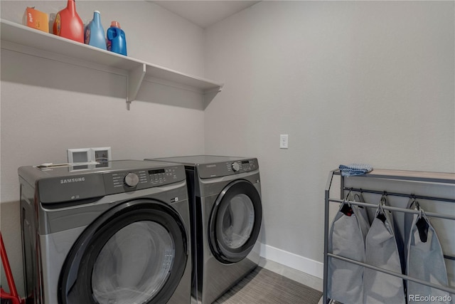 9836 Banner Peak St, Littleton, CO 80125 - clothes washing area featuring separate washer and dryer and baseboards