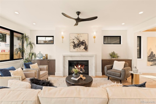 2610 N Monroe St, Denver, CO 80205 - living room featuring a ceiling fan, a fireplace, recessed lighting, baseboards, and wood finished floors