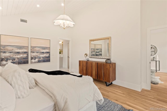 2610 N Monroe St, Denver, CO 80205 - bedroom featuring light wood-type flooring, a chandelier, baseboards, wood ceiling, and recessed lighting