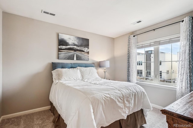 bedroom featuring carpet flooring, visible vents, and baseboards