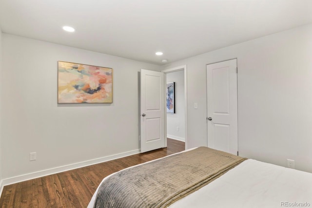 bedroom featuring recessed lighting, wood finished floors, and baseboards