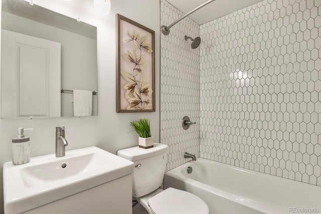 bathroom featuring shower / bath combination, vanity, and toilet