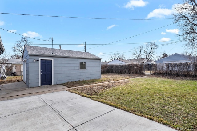 exterior space featuring an outdoor structure and fence