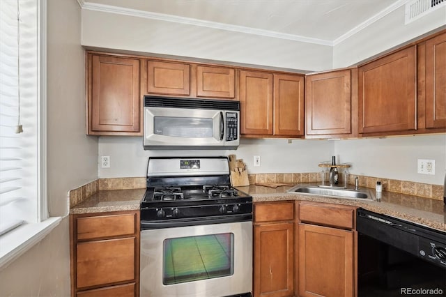 kitchen featuring sink, crown molding, and stainless steel appliances